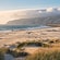 The sands of Guincho Beach near a mountain in Cascais, Portugal